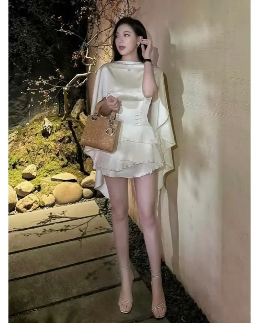 Photo 3 of Đầm mini lụa kem choàng vai nữ