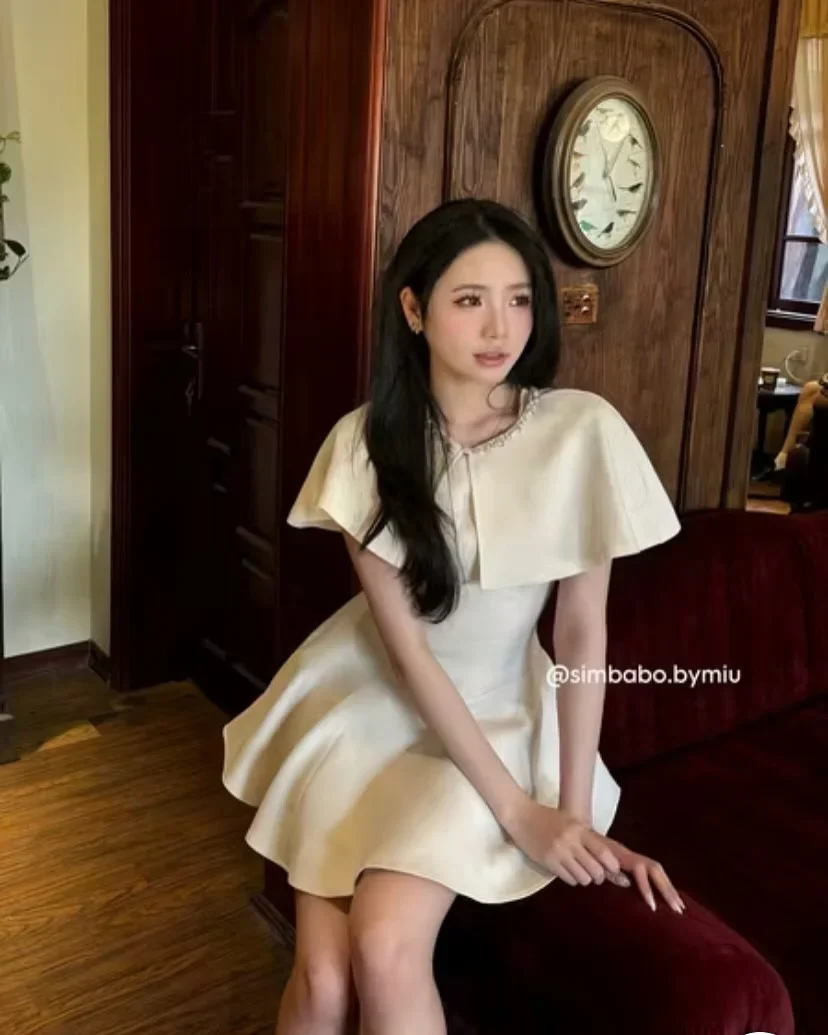 Photo 3 of Đầm satin kem tay cánh dơi nữ