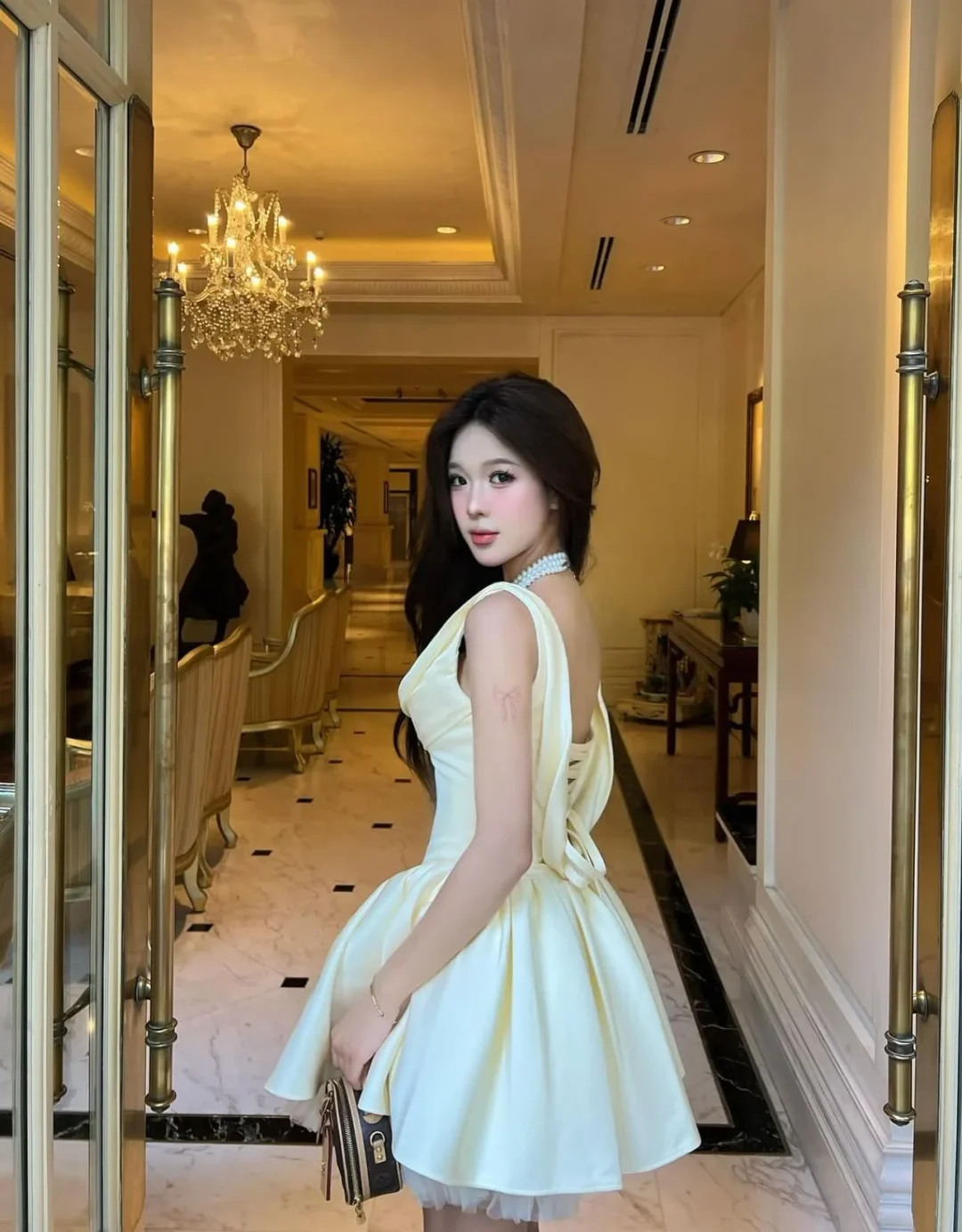 Photo 2 of Váy satin trễ vai vàng nhạt Jubin Studio