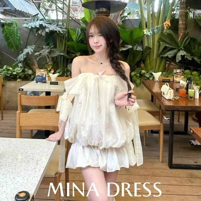 Ảnh 1 của Đầm Babydoll Trắng Trễ Vai Nơ Hồng