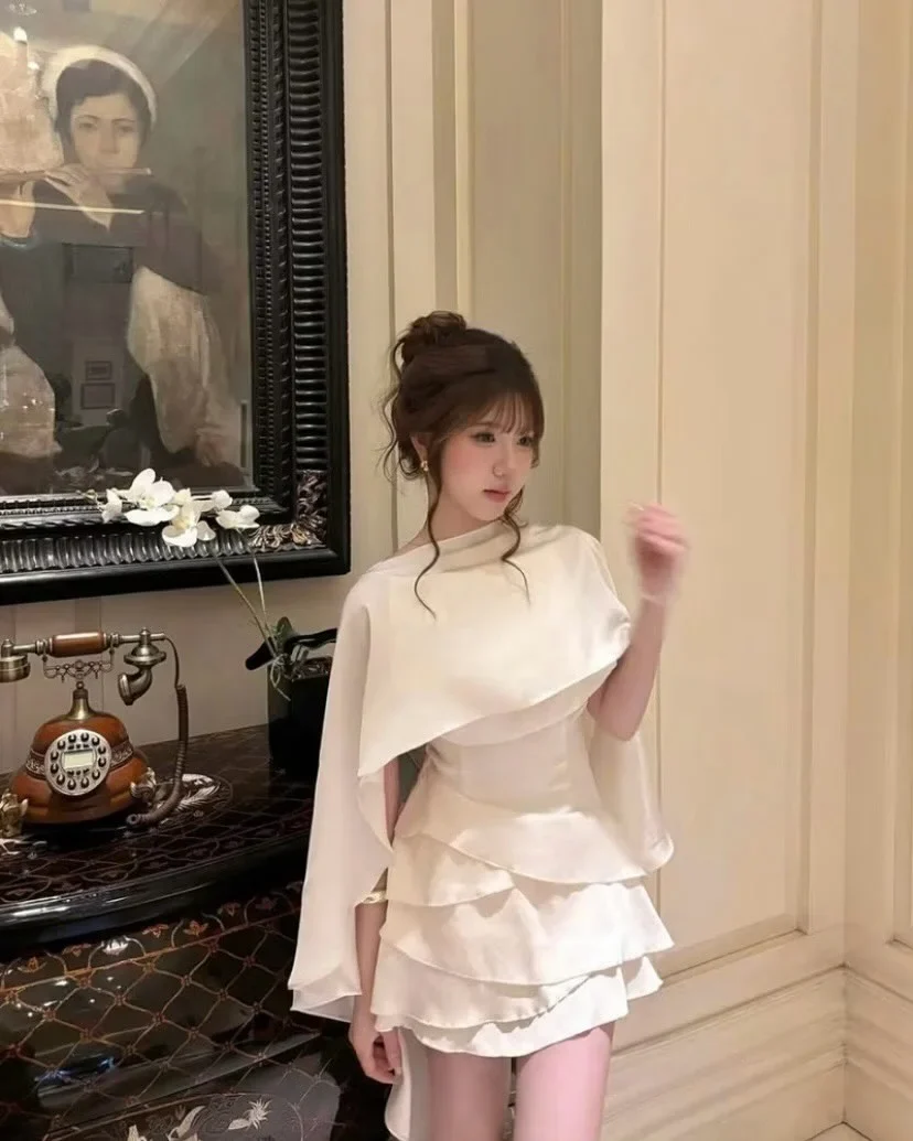 Photo 1 of Đầm mini lụa kem choàng vai nữ