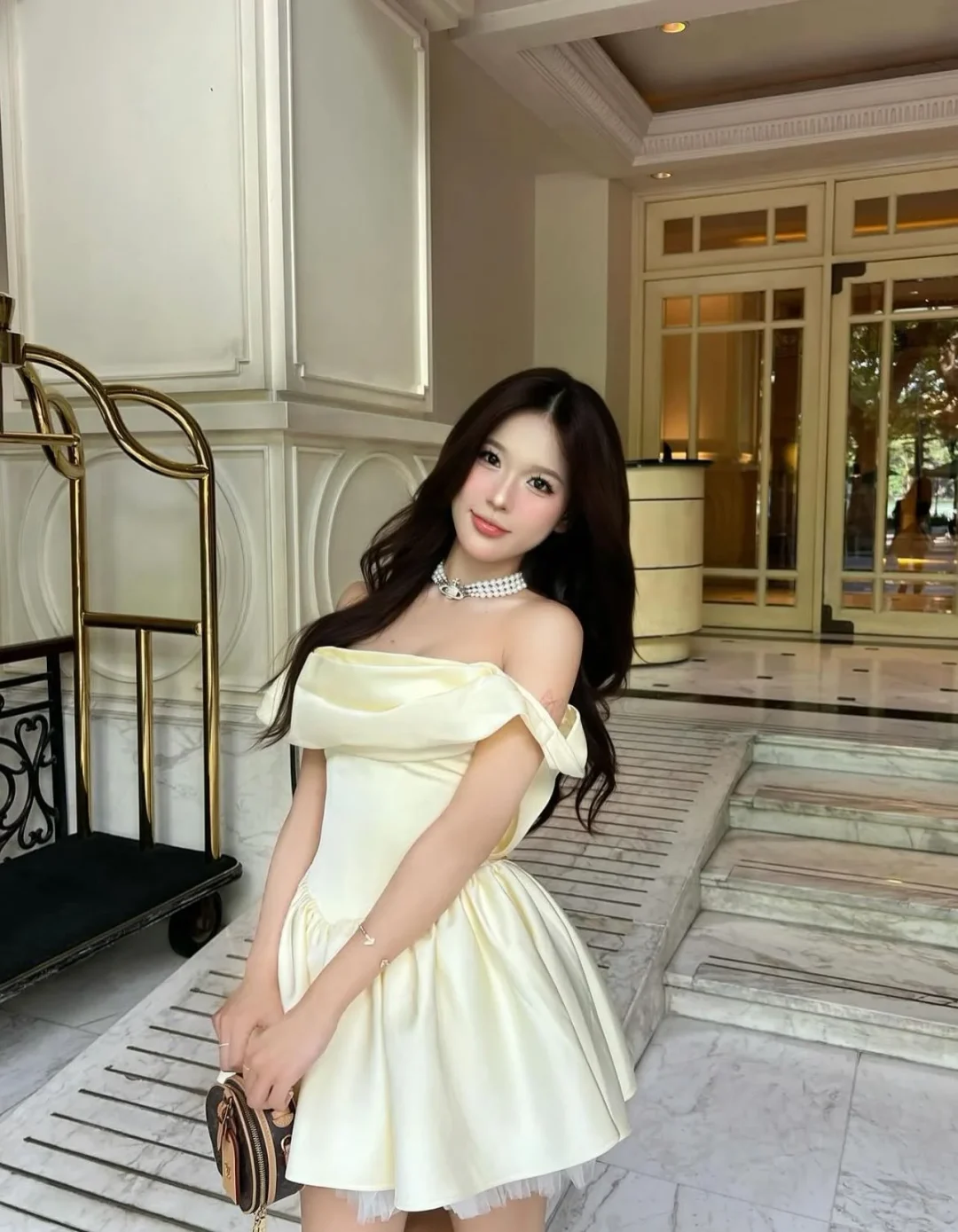 Photo 1 of Váy satin trễ vai vàng nhạt Jubin Studio
