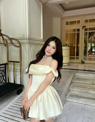 Photo 1 of Váy satin trễ vai vàng nhạt Jubin Studio