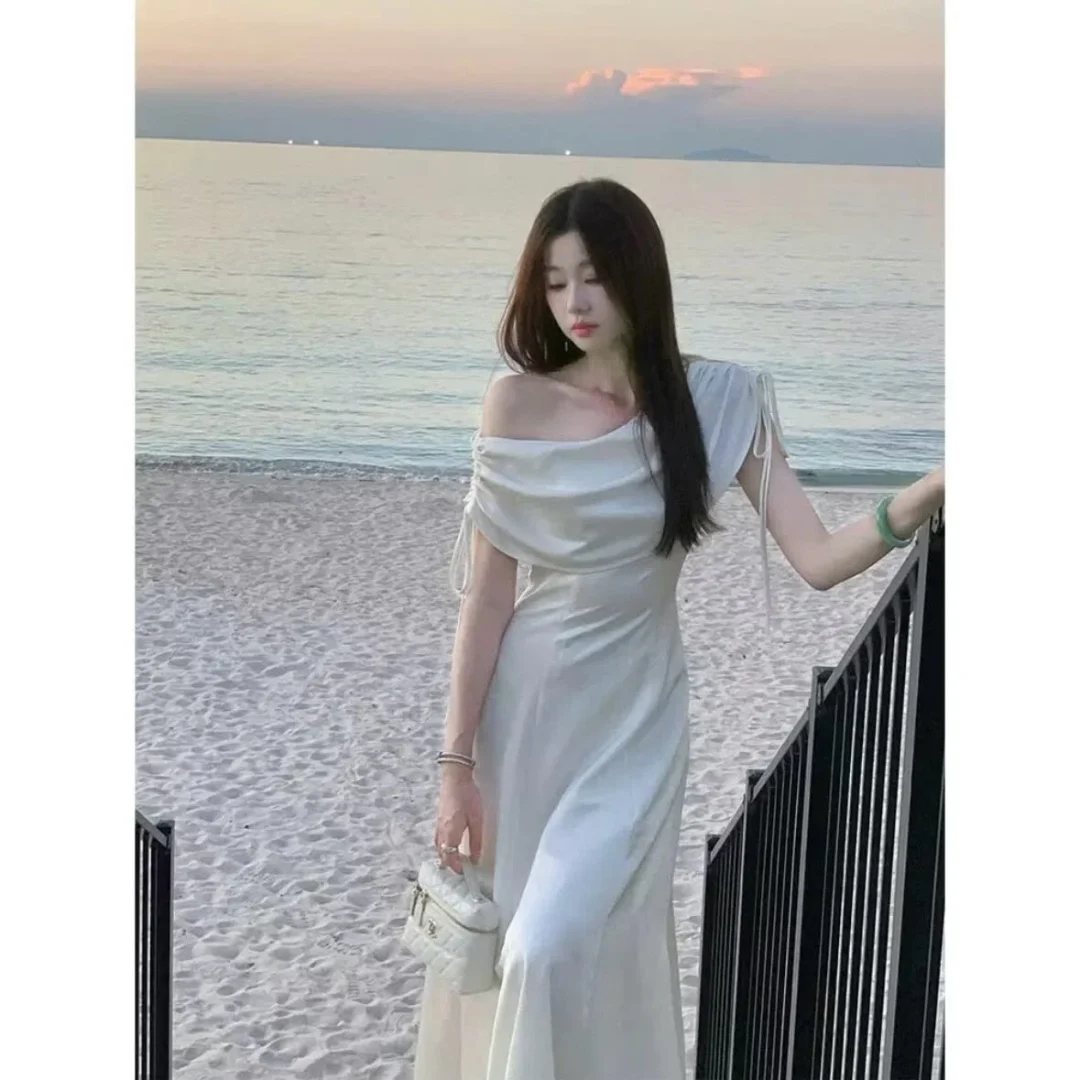 Photo 2 of Váy tiệc lụa trắng trễ vai nữ