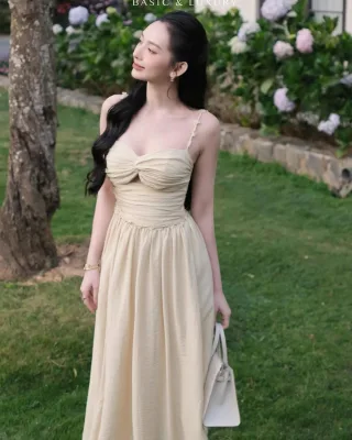 Photo 2 of Váy maxi hai dây vàng nhạt nữ tính
