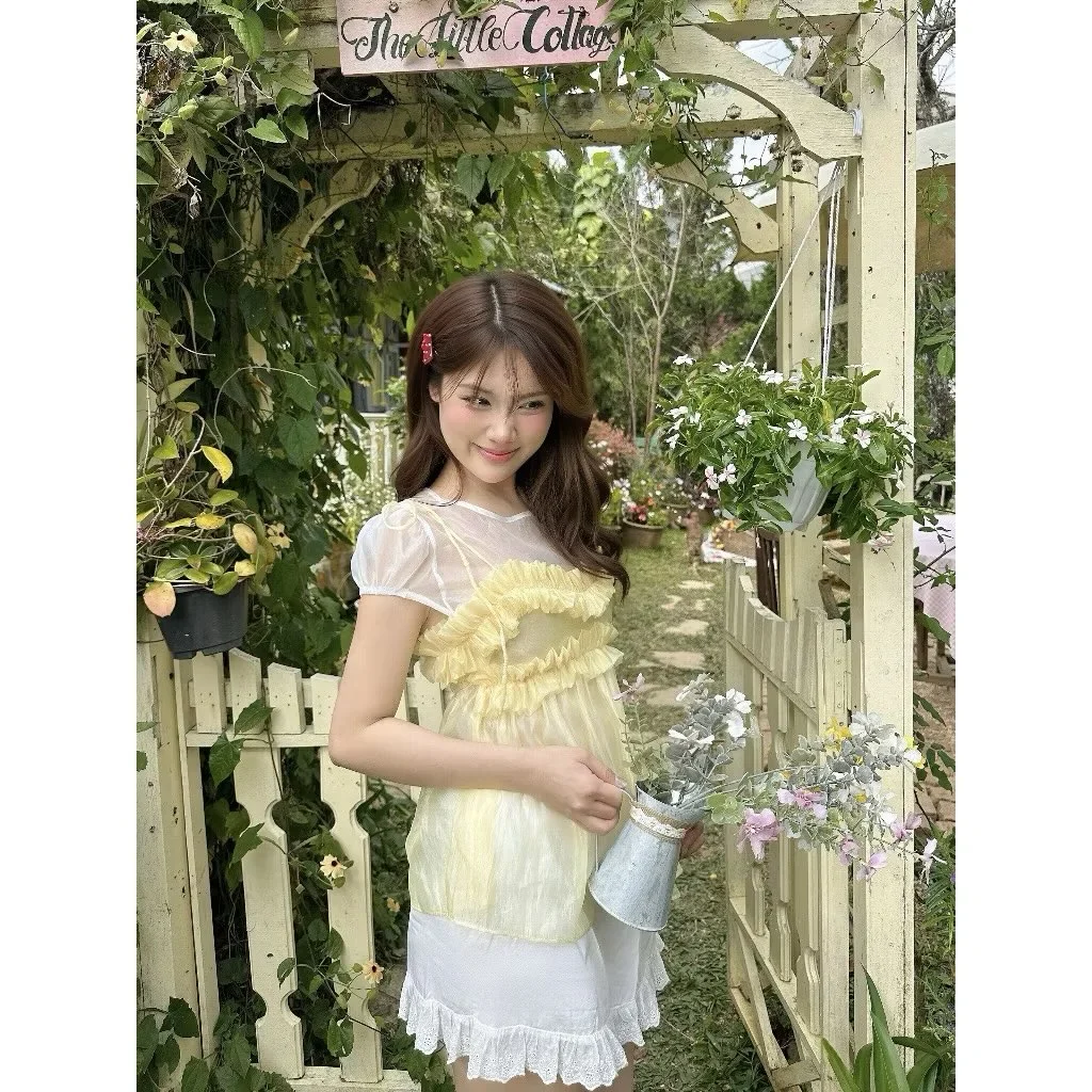 Photo 7 of Set áo voan vàng và chân váy trắng nữ