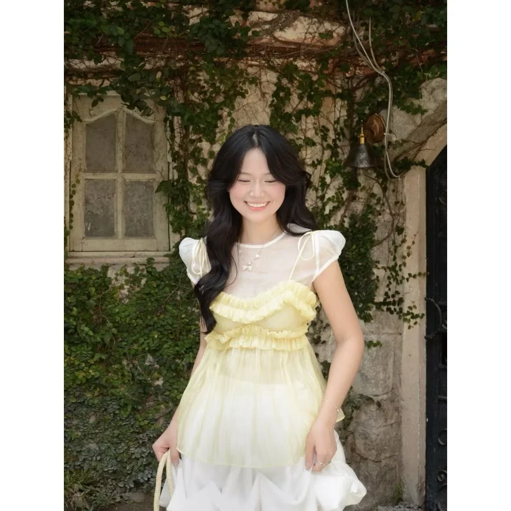 Photo 1 of Set áo voan vàng và chân váy trắng nữ