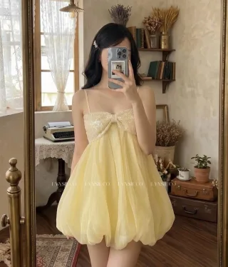 Ảnh 3 của Váy ngắn voan vàng nhạt nơ sequin