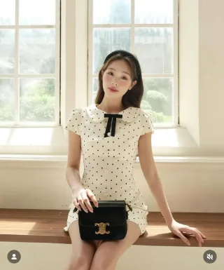 Photo 1 of Đầm ngắn chấm bi trắng cổ sen nơ đen
