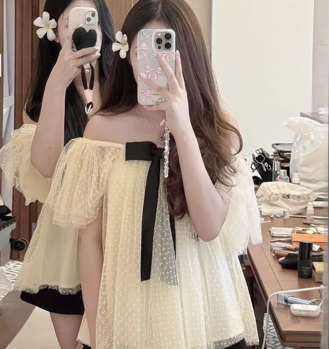 Ảnh 6 của Set áo voan kem nơ đen chân váy ngắn nữ