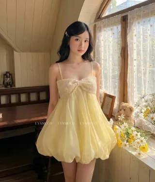 Ảnh 1 của Váy ngắn voan vàng nhạt nơ sequin