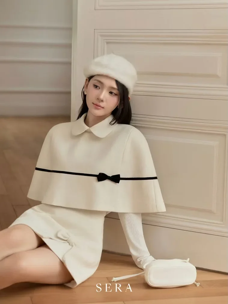 Ảnh 6 của Set áo cape váy ngắn trắng nữ