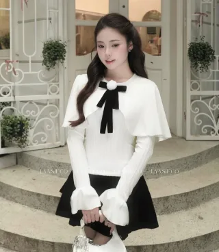 Photo 1 of Áo len trắng nơ nhung tay loe kèm váy đen
