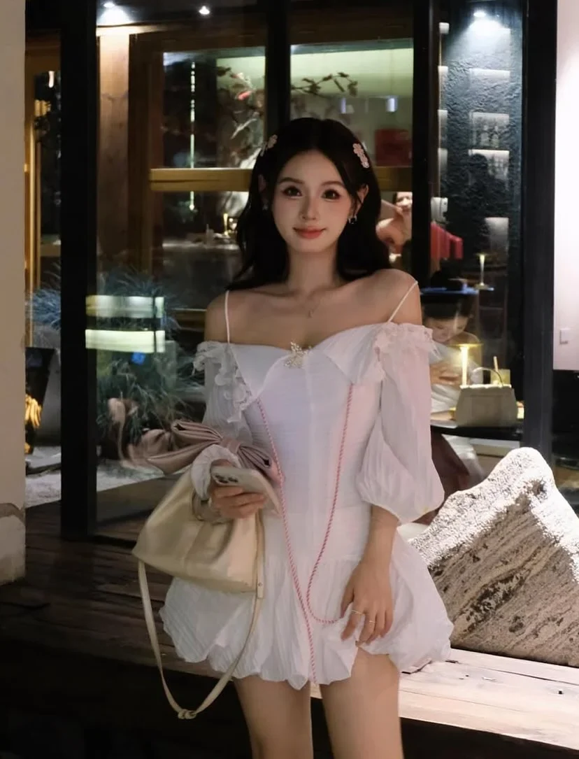 Photo 2 of Váy trắng trễ vai corset tay phồng