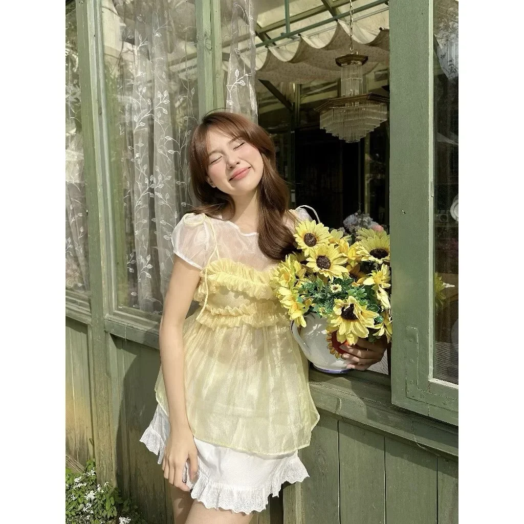Photo 3 of Set áo voan vàng và chân váy trắng nữ