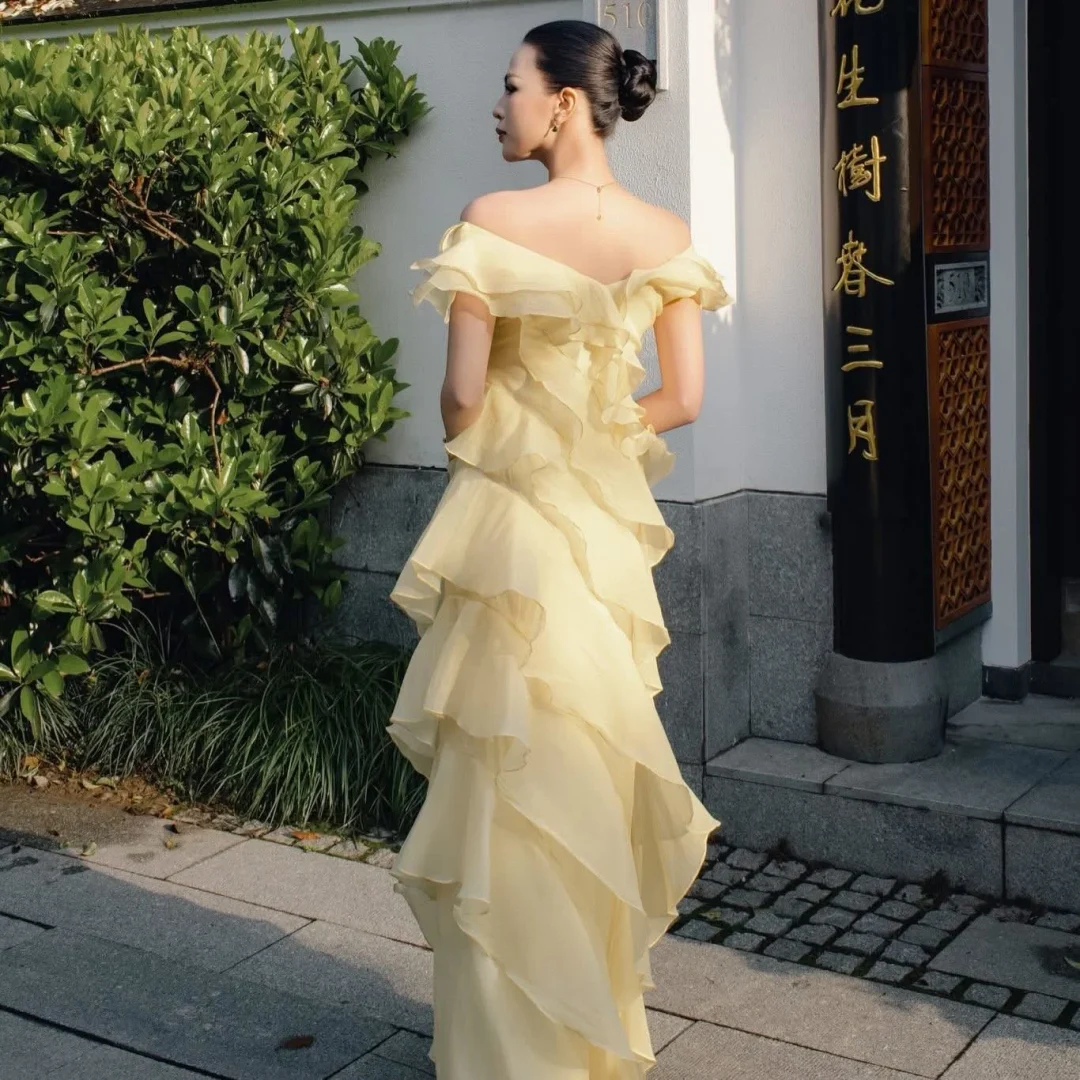 Photo 4 of Váy dự tiệc trễ vai ruffle vàng nhạt NAN