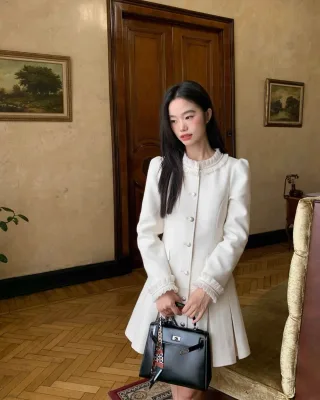 Photo 1 of Váy len trắng xếp li cổ ren KANO