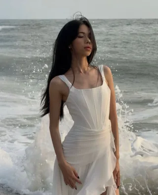 Photo 2 of Đầm tiệc trắng hai dây Mafee Couture