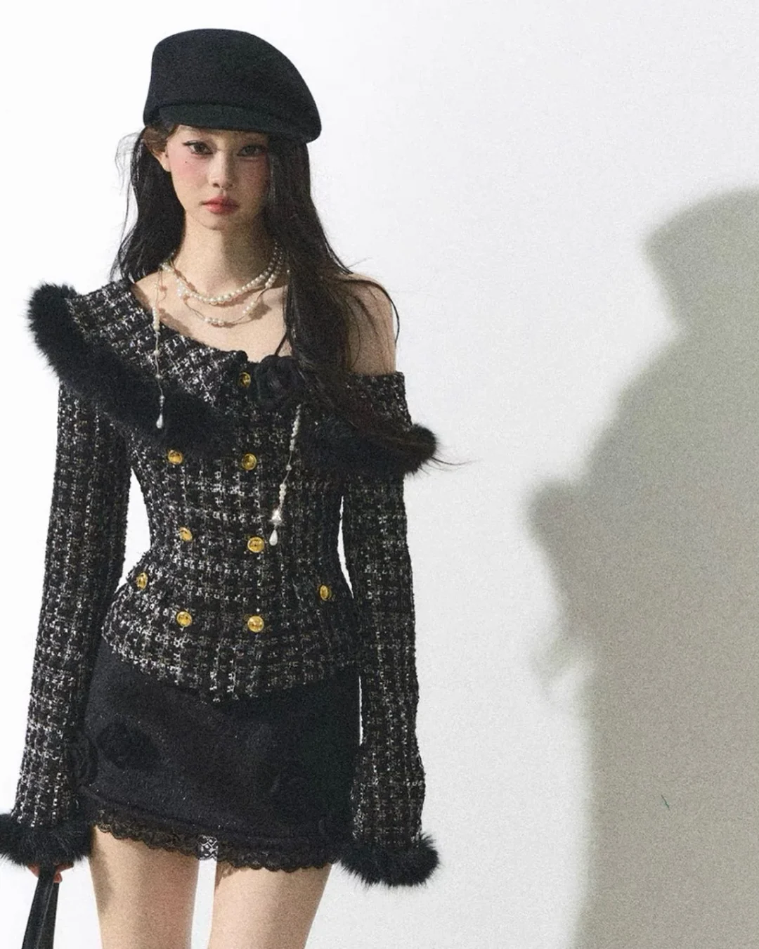 Photo 7 of Set áo tweed đen lệch vai và váy ngắn đính hoa